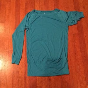 A Blue exercise top. Long sleeve. Nike Dri-Fit